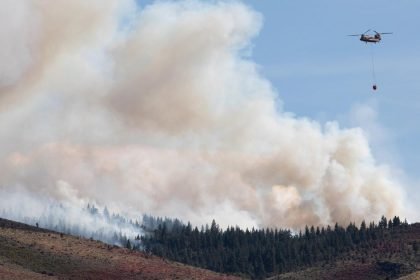 Firefighters battle flames and smoke near Reno fueled by drought and wind