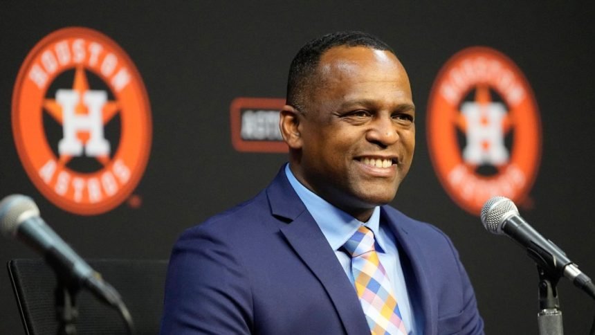 Brown out as GM of 1st-place Astros after skid